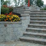 Retaining wall, with steps and low-voltage lighting.