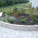 Patio and seat wall extended the usable space around the pool.